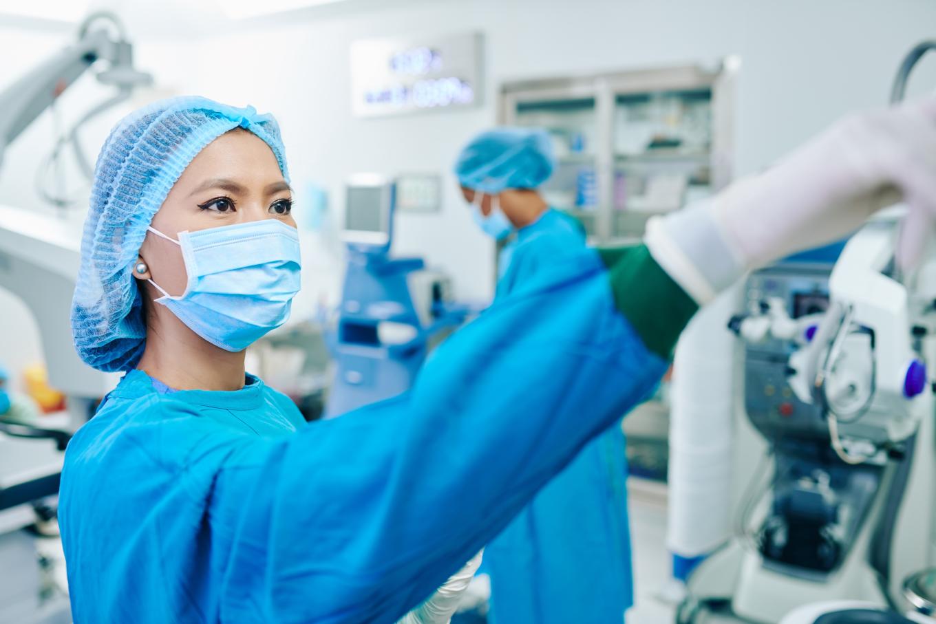 Surgical techs checking equipment